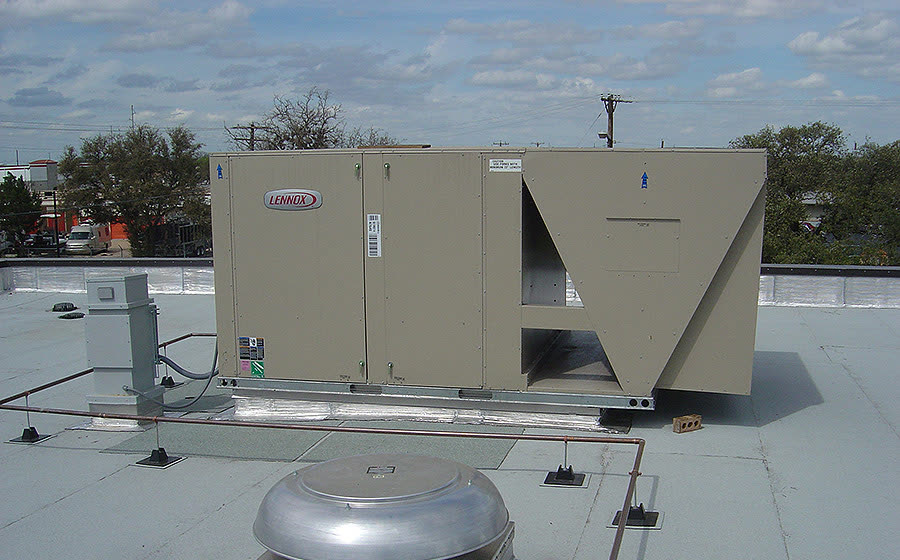 A packaged rooftop AC unit and exhaust fans on a commercial roof, from Rabroker’s project gallery